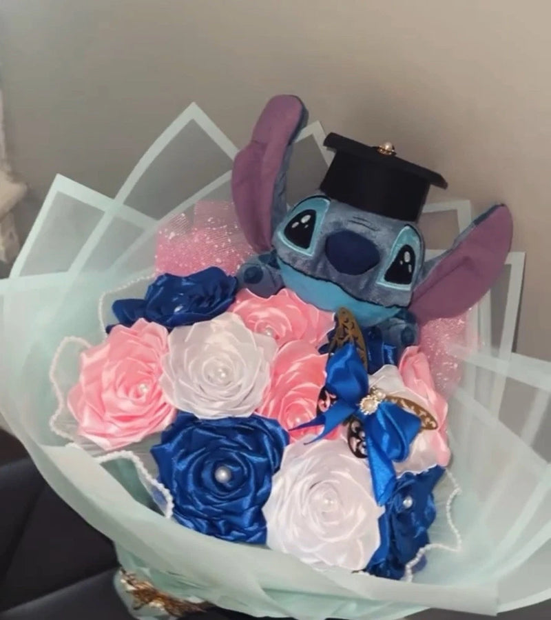 Ribbon rose bouquet with pink and blue flowers and Stitch plush centerpiece