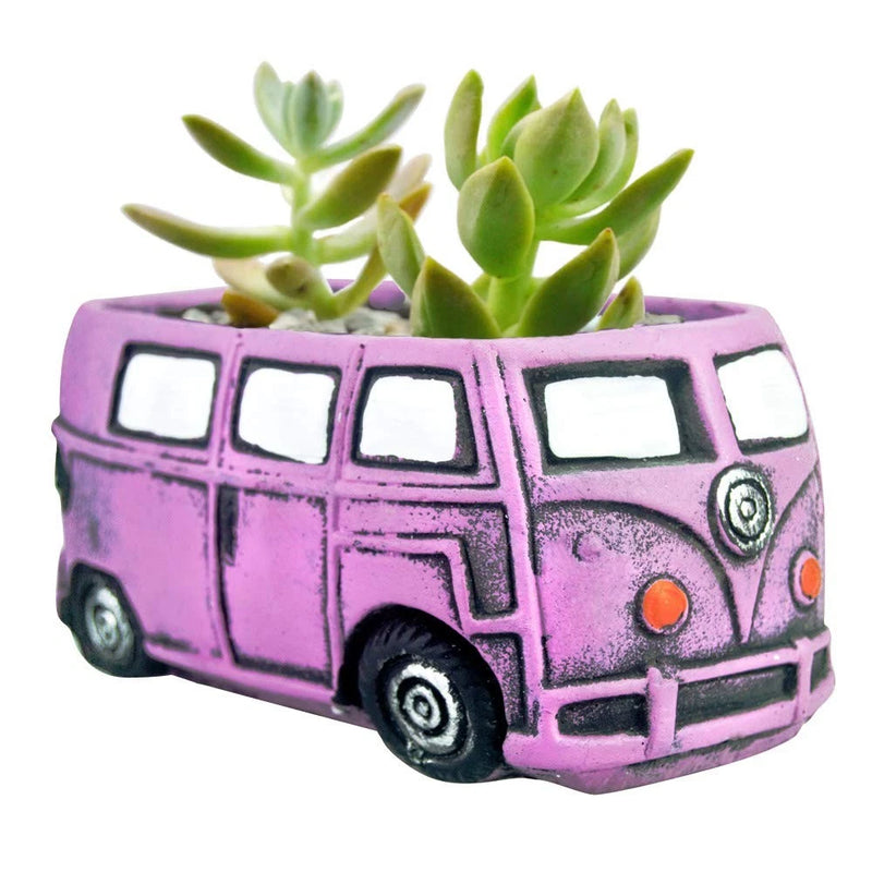Purple bus-shaped succulent planter pot with small green succulents
