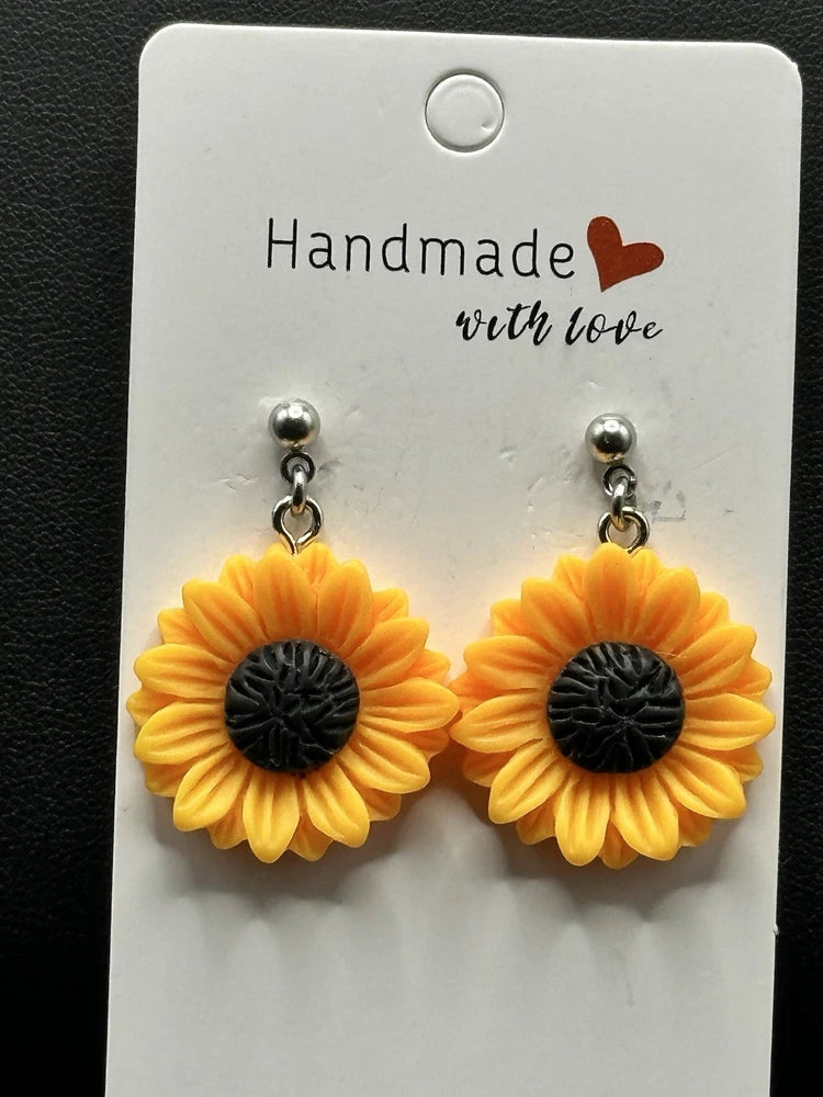 Orange sunflower drop earrings on stainless steel ball studs, black center