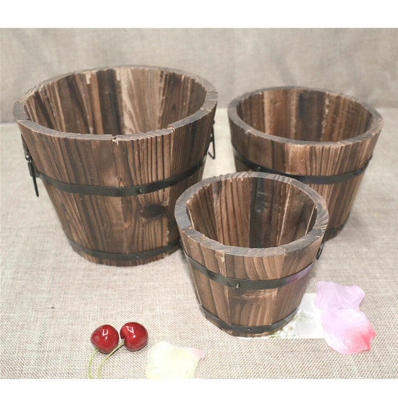 Vintage wooden bucket planter with metal handles, round slatted design for indoor or outdoor plants