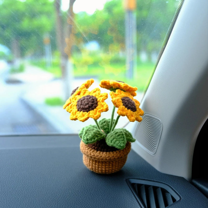 Crochet potted sunflower car dashboard decor with yellow flowers, green leaves, brown pot