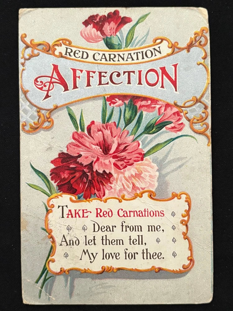 Antique Valentine postcard with red carnation flowers and cursive text, creased edges