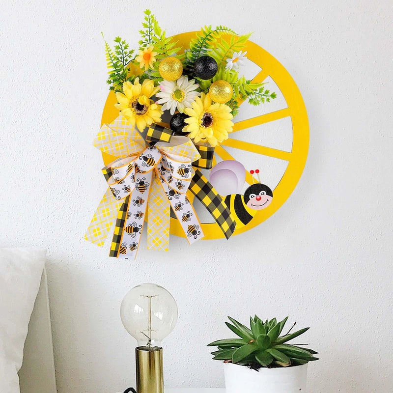 Artificial sunflower wreath with bee, black and yellow accents, and plaid bow