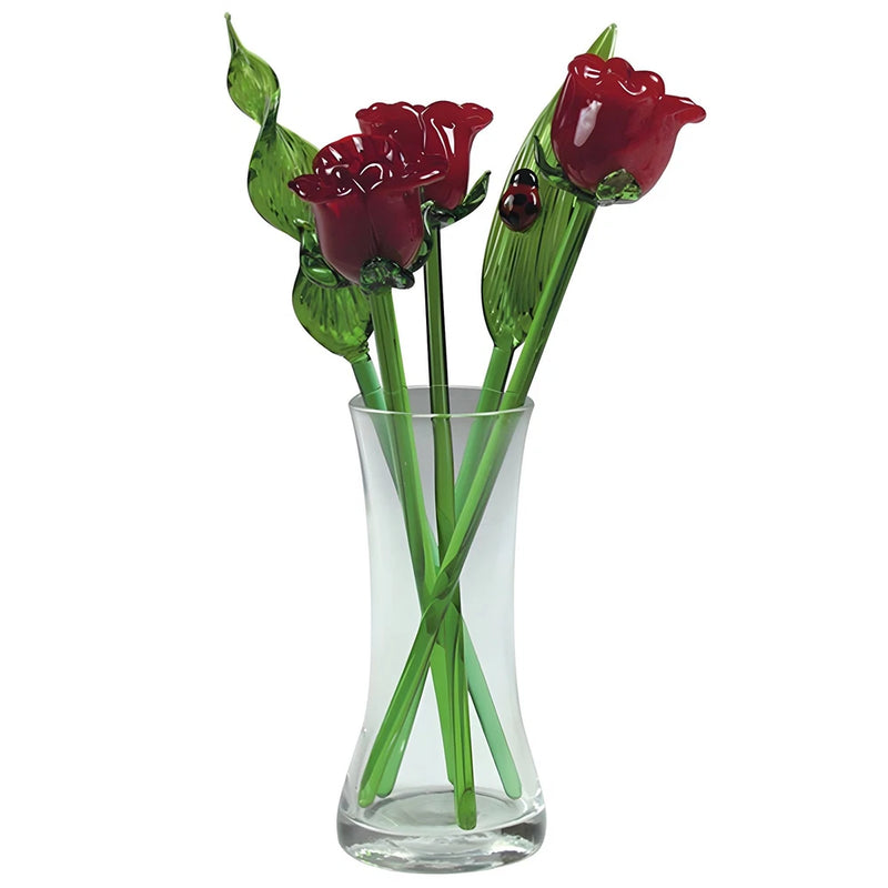 Decorative glass vase with red rose flower bouquet and green stems