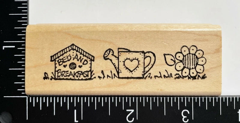 Sunflower garden rubber stamp on wood block with watering can and birdhouse