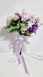 Wedding bouquet. Artificial flowers accessory with pearls and ribbons Bouquet