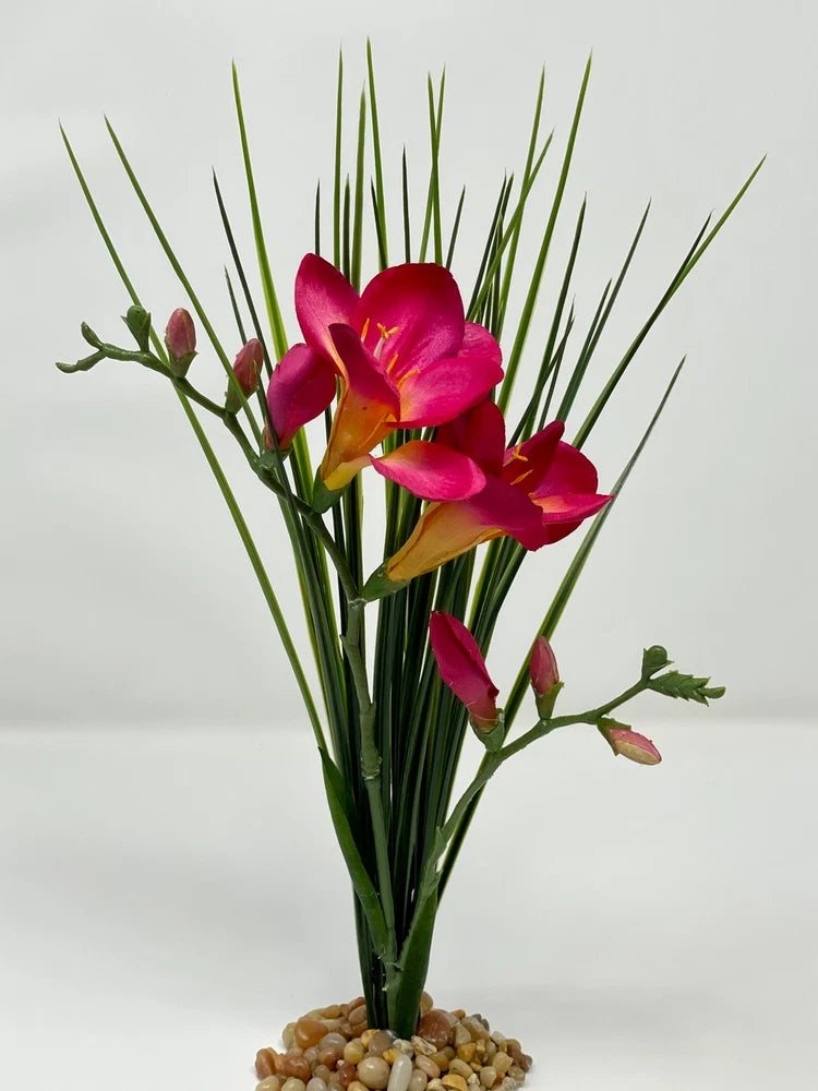 Magenta and pink dried flower bouquet with freesias and green stems