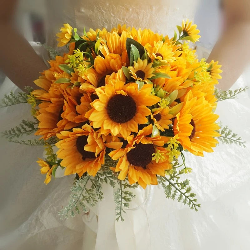 Sunflower wedding bride bouquet with orange-yellow sunflowers, dark centers, and greenery