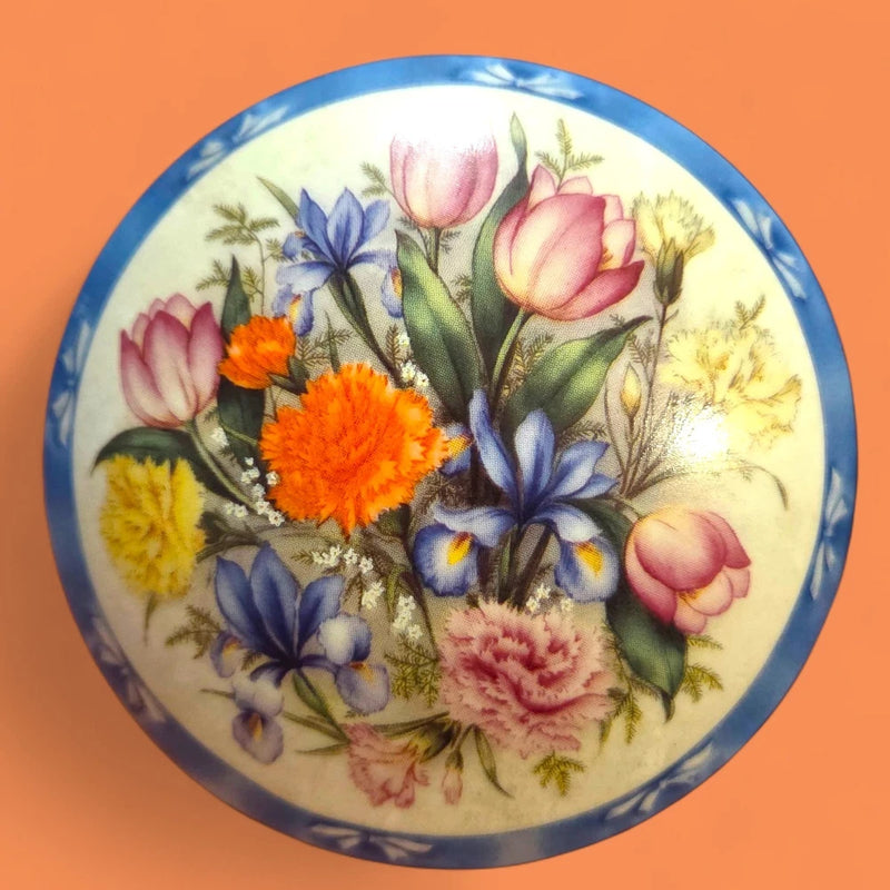 Porcelain music box lid with multicolor spring flowers and blue trim