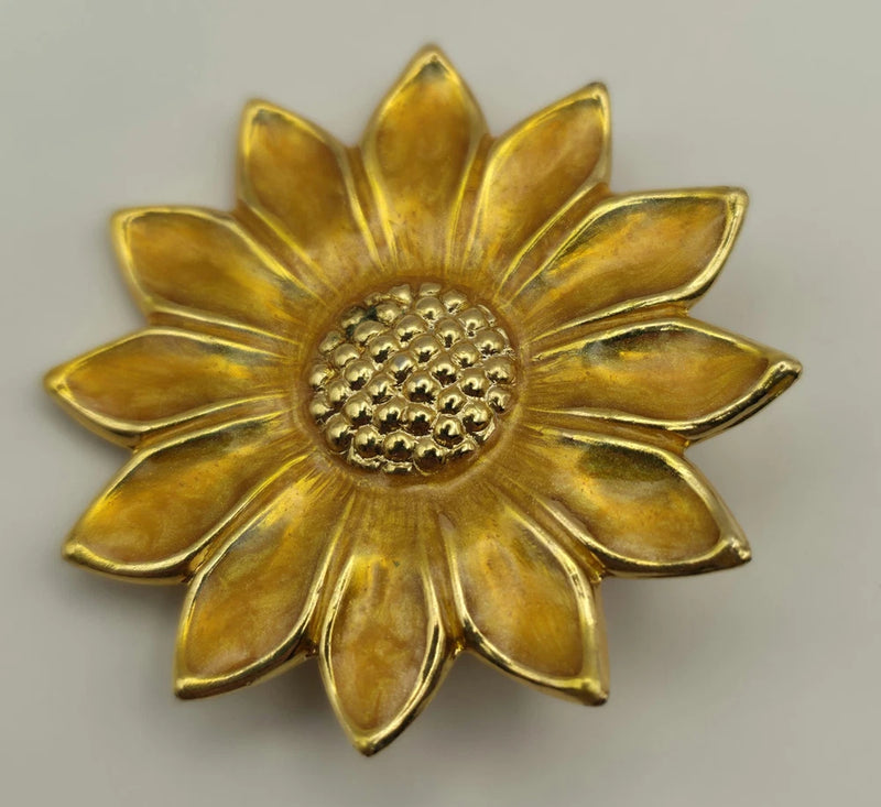 Gold sunflower scarf pin with detailed center and petal design