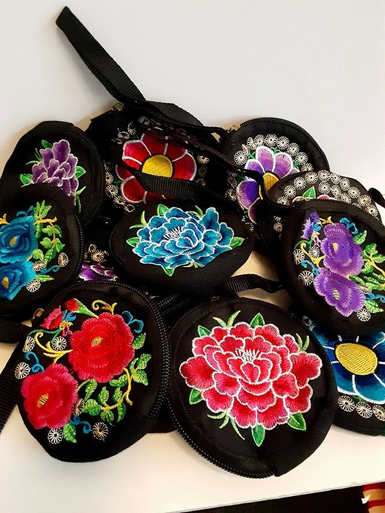 Set of black embroidered flower coin purses with wrist straps