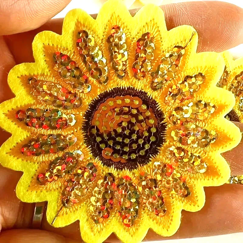 Yellow sunflower iron-on patch with gold, red, green sequins and a dark sequin center
