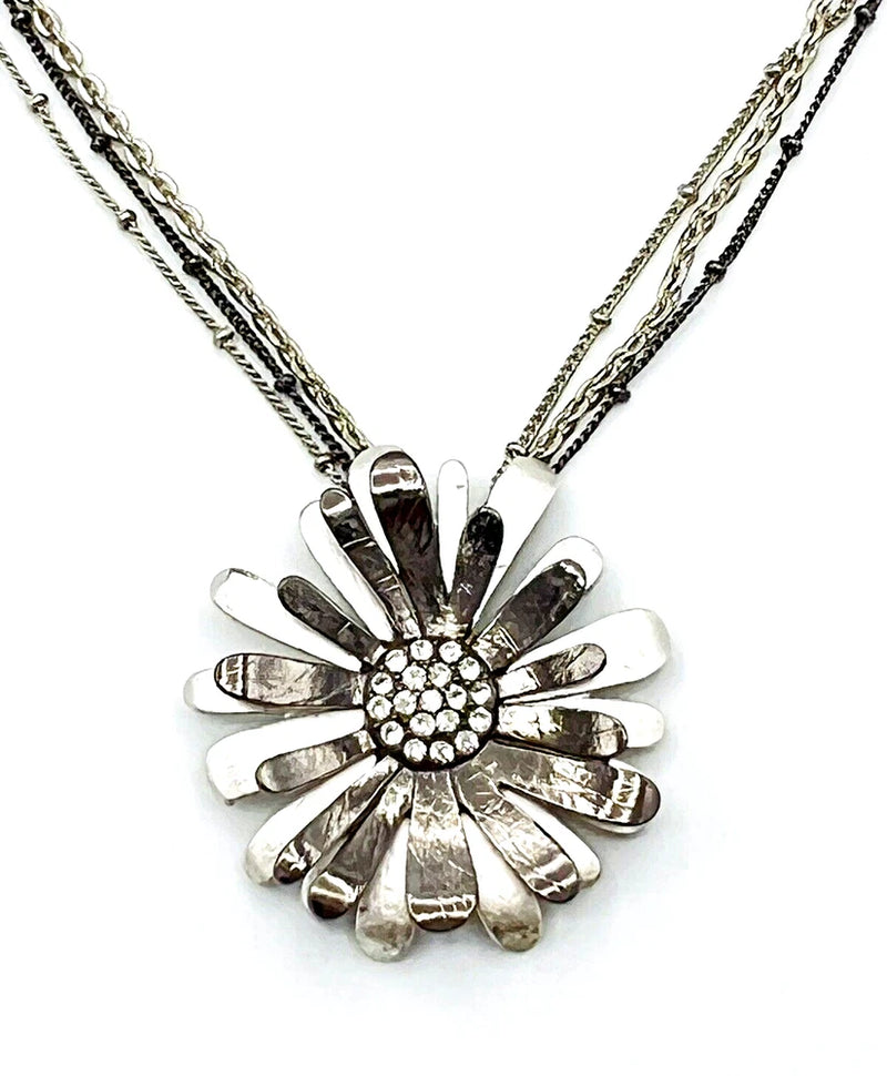 Silver-tone triple chain sunflower pendant necklace with crystal center and cutout petals