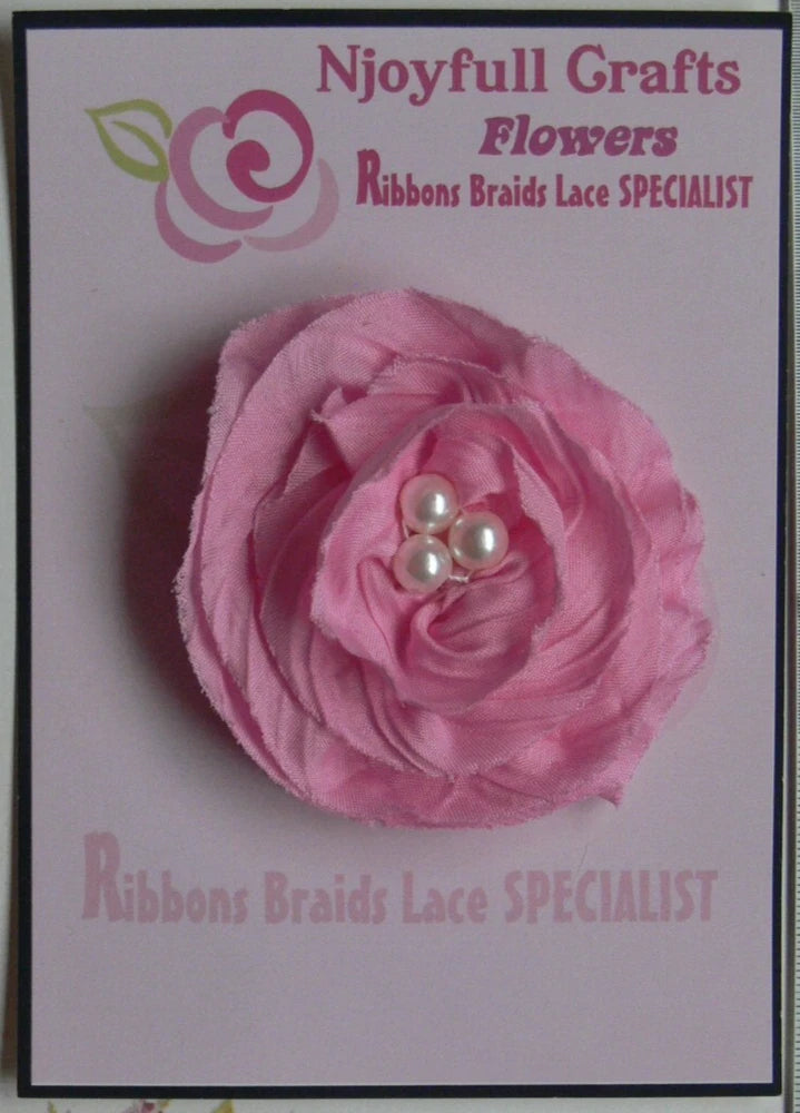 Pink chiffon gathered flower with layered petals and three-pearl center