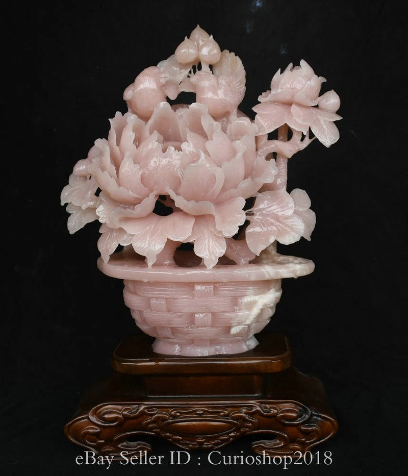 Carved pink jade peony flower statue in woven basket pot on wooden base