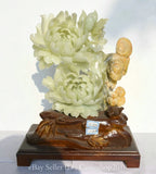 Carved jade peony and ganoderma lucidum sculpture on dark wooden base