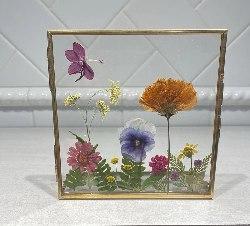 Dried pressed flower bouquet in brass double-glass floating frame with multicolor blooms