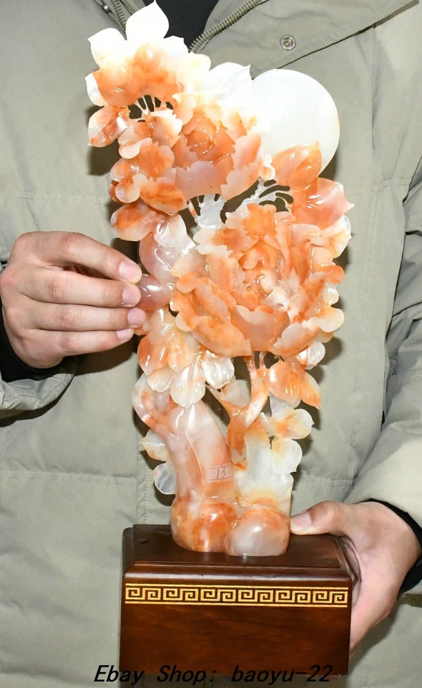 Carved jade peony flower statue, hollowwork with peach and white petals, on dark gold base
