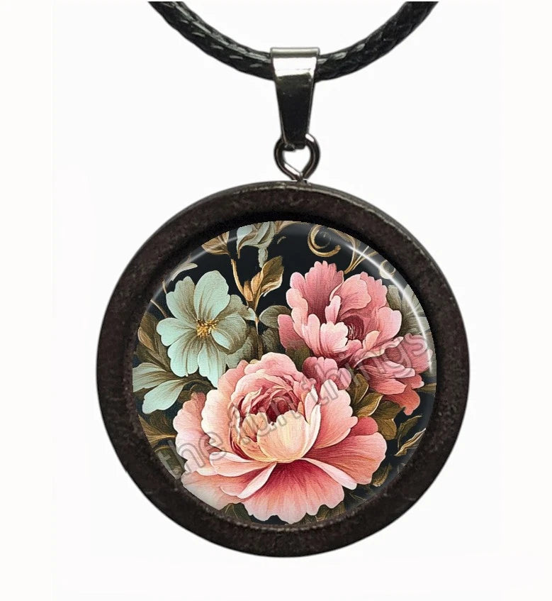 Round peony floral pendant necklace with pink, peach and cream flowers; black cord.