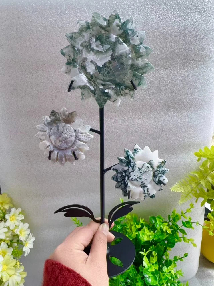 Crystal flower on black stand with pale green and white carved petals