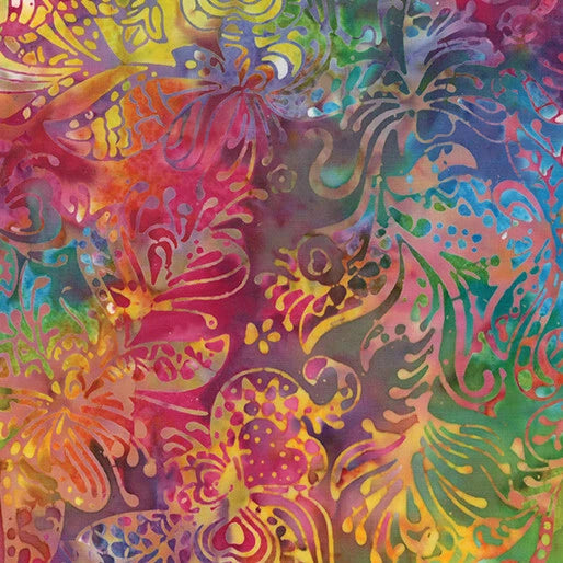 Batik fabric with vibrant floral and leaf pattern in rainbow colors