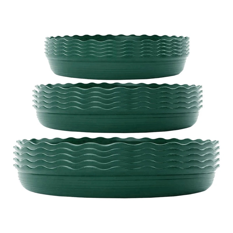 Set of three dark green ribbed plant saucers with wavy edges