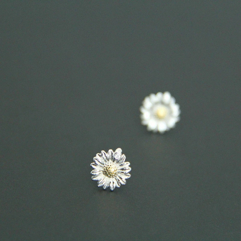 Rhodium vermeil sunflower stud earrings with silver petals and gold-tone center