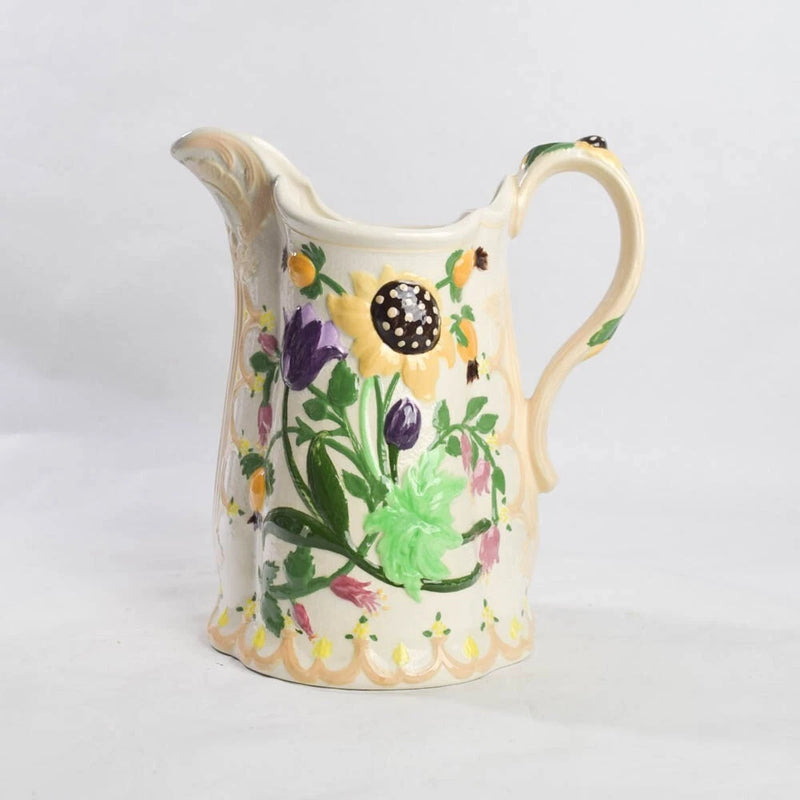 Hand-painted ceramic pitcher with cream body, sunflower and floral multicolor pattern