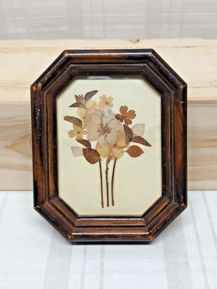 Octagonal vintage frame with pressed dried flowers bouquet artwork