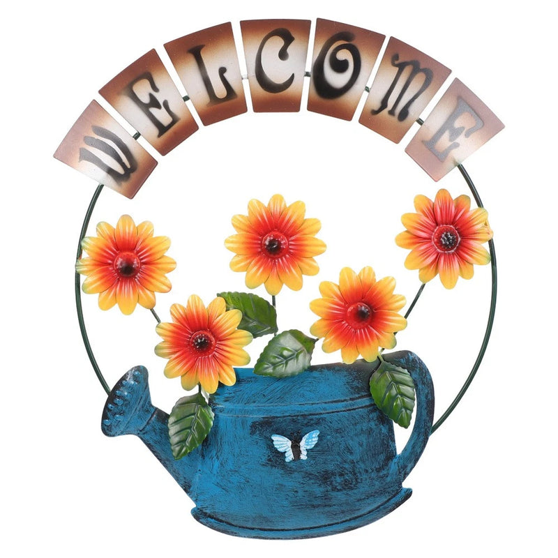 Circular metal welcome sign with sunflowers, blue pot, butterfly and arched WELCOME text