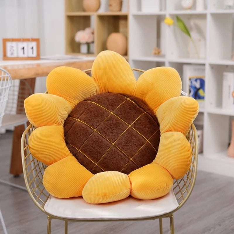 Sunflower-shaped throw pillow with yellow corduroy petals and brown stitched center