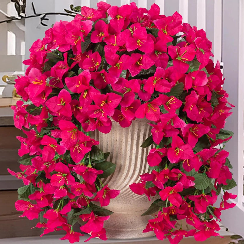 Artificial faux bougainvillea flower plant, bright pink blooms and green leaves