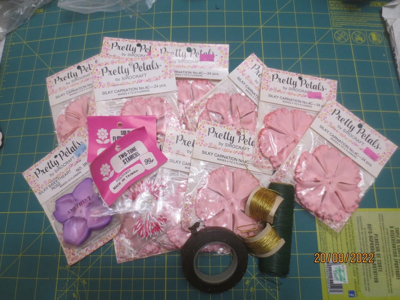 Assorted satin flower petals and rosettes in pink and purple packaging set