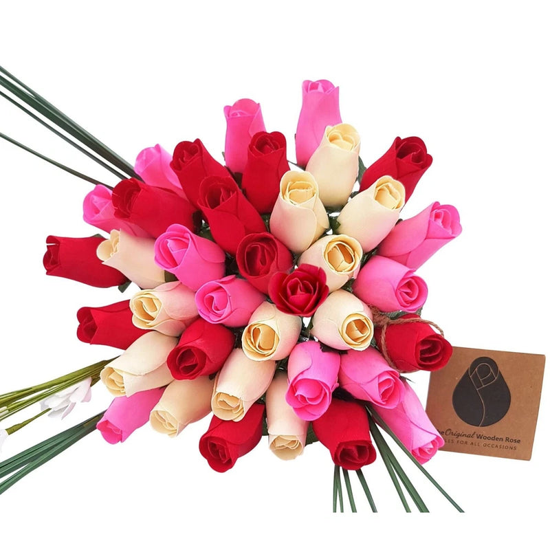 Mixed-color wooden rose bouquet with red, pink, and cream blooms and a kraft gift tag