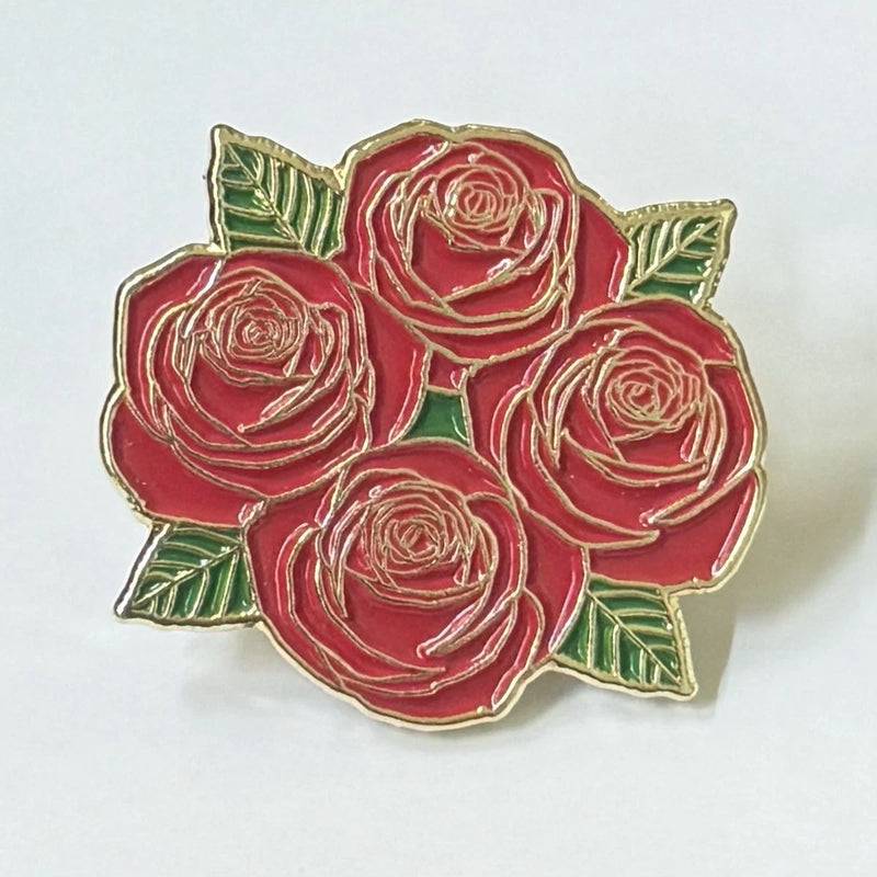Four Roses gold-tone enamel lapel pin with red roses and green leaves