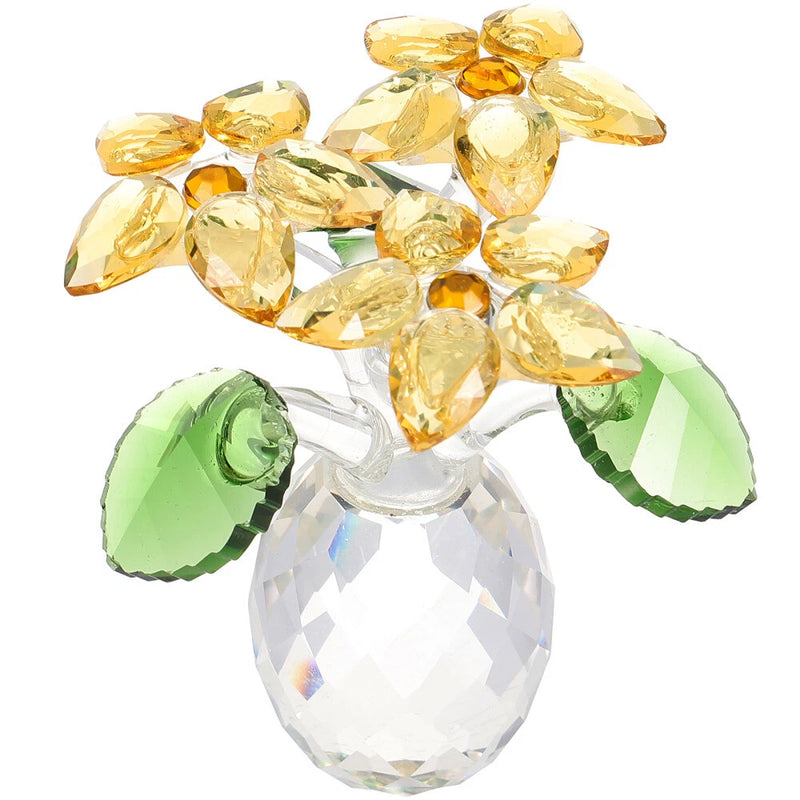 Faceted crystal sunflower figurine with golden petals and green leaves, clear base