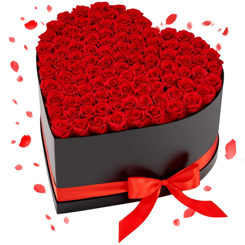 Red preserved roses in heart-shaped gift box with red ribbon