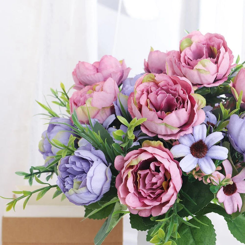Artificial peony flower bouquet with pink and lavender blooms and green leaves