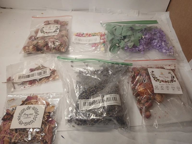Assorted dried flowers in sealed plastic bags, assorted colors and sizes