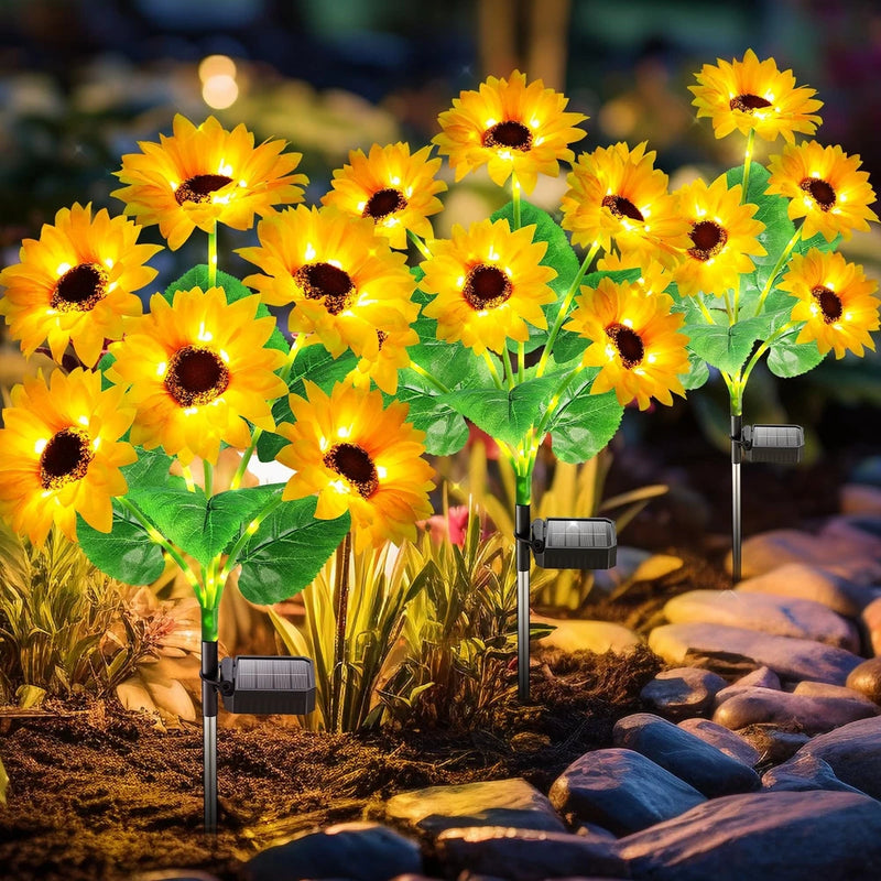 Solar sunflower garden lights, three pack with yellow blooms and small solar panels