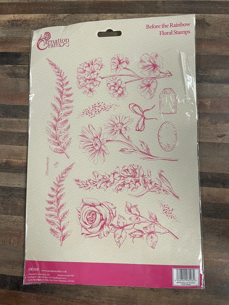 Floral stamp set with pink botanical designs on clear stamps, in retail package