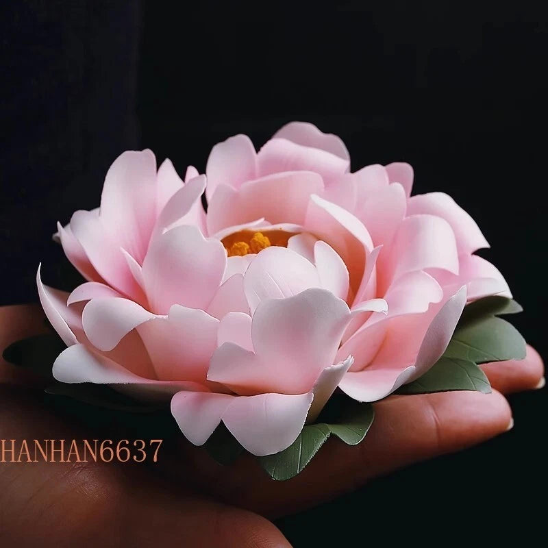 Pink peony ceramic statue ornament with layered petals and green leaves
