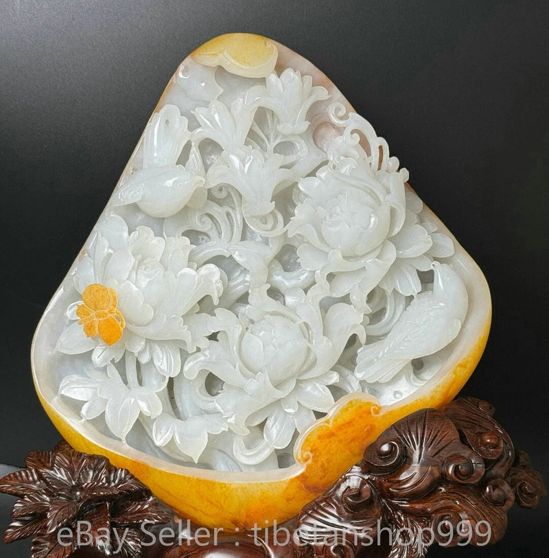 White Hetian jade carving of peony flowers and butterfly, triangular pendant-style statue