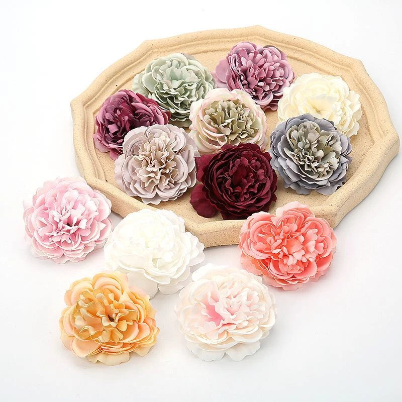 Assorted artificial silk peony head flowers in pink, peach, white, and dark red