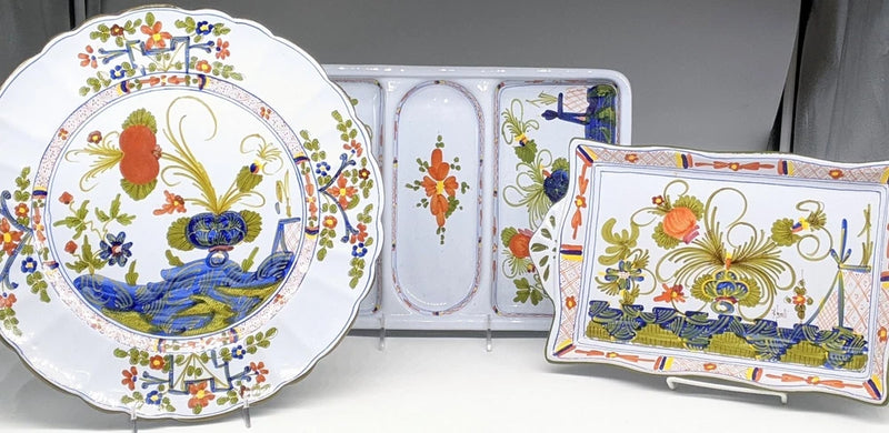 Decorative majolica serving plate with bird and floral pattern, plus rectangular dish
