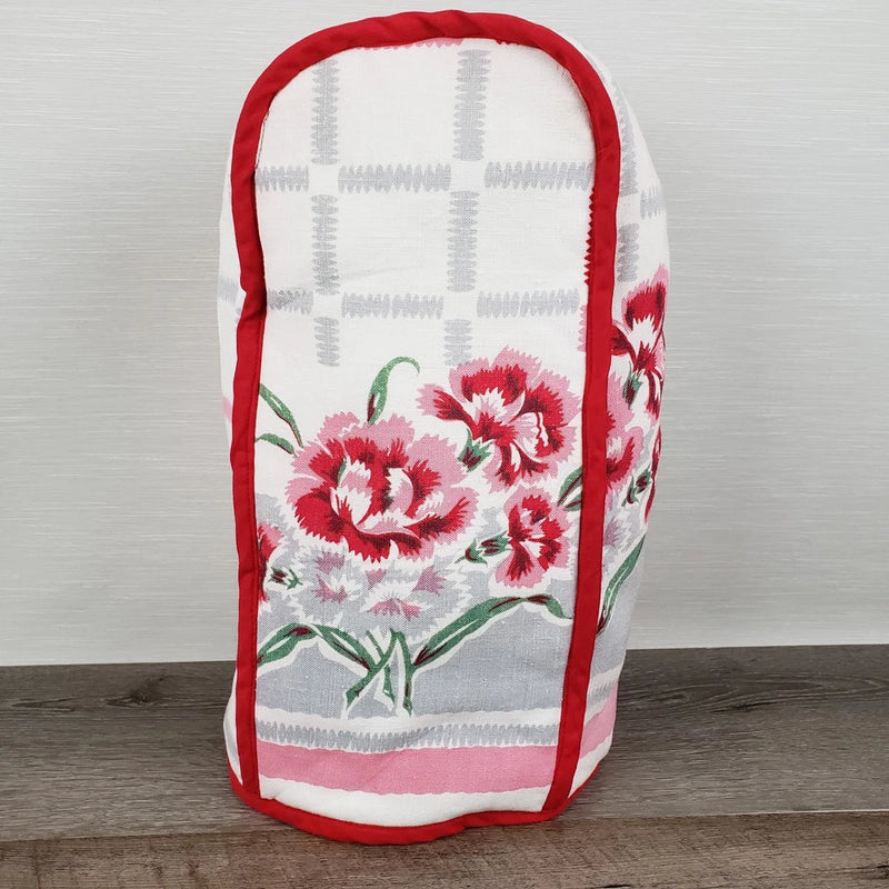 Blender appliance cover with red trim and pink carnation floral print