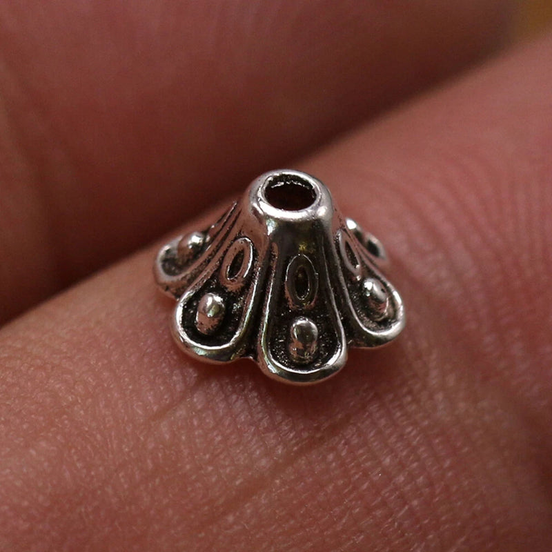 Silver-tone lily bead cap pendant charm with decorative flower pattern