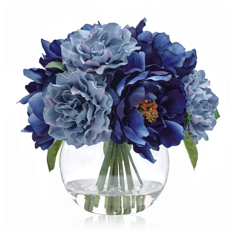 Artificial blue peony flower bouquet in clear glass vase with faux water