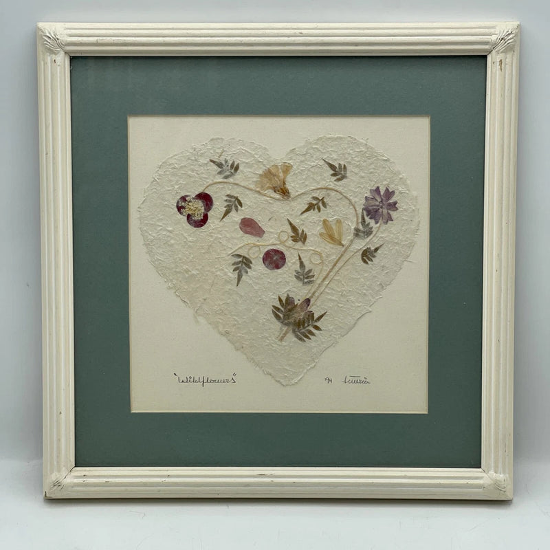 Framed pressed flower heart collage with colorful dried petals and leaves