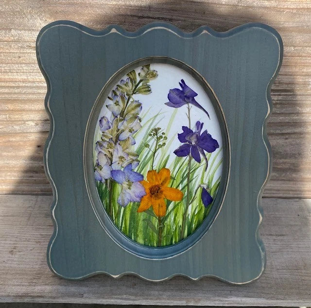 Handmade watercolor scene adorned with pressed real dried flowers in green frame Dried Flower